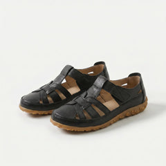 Sandali comfort neri con cinturini in pelle e suola in gomma marrone