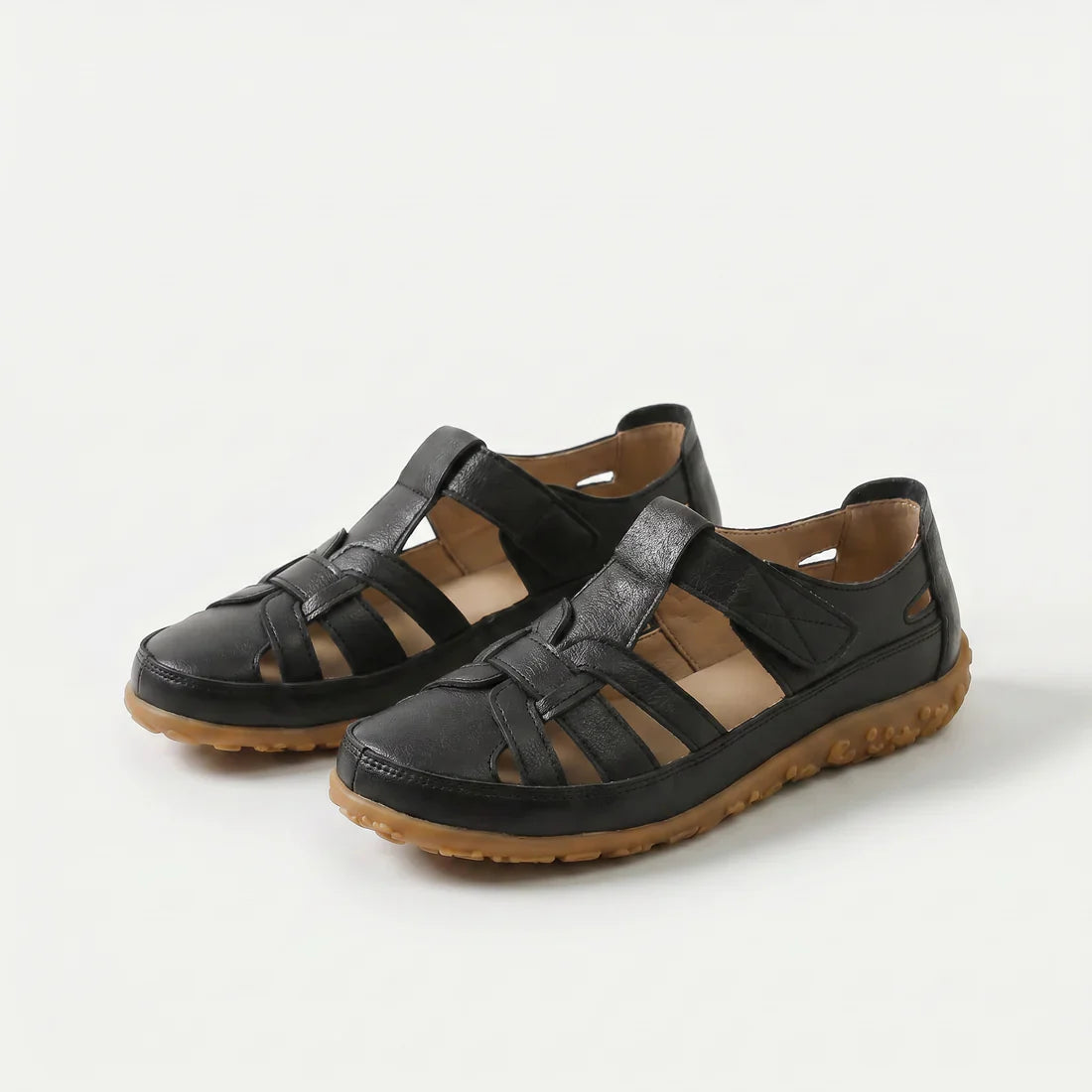 Sandali comfort neri con cinturini in pelle e suola in gomma marrone