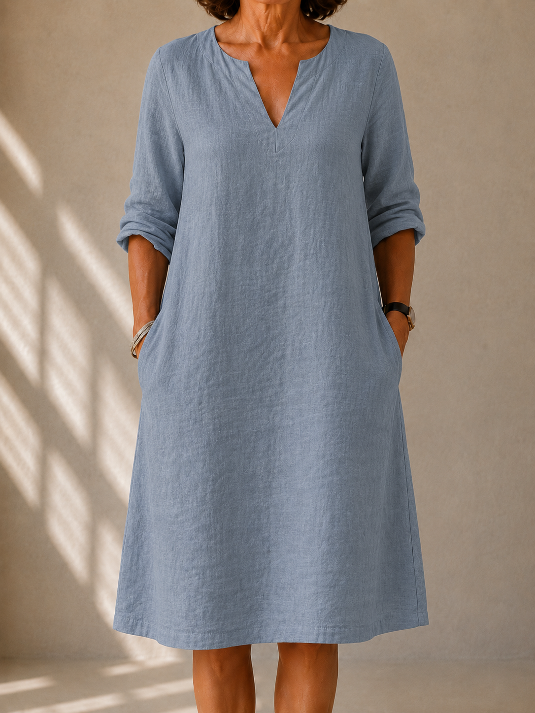 Light blue V-neck midi dress with 3/4 sleeves and relaxed loose fit