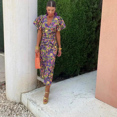 Abstract print midi dress with V-neck and puff sleeves, gathered waist, side view