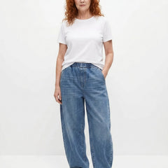 Blue relaxed elastic-waist denim trousers with wide legs and visible front seams