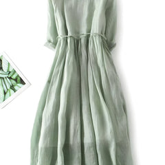Amara vintage dress in sage green, pleated skirt and ribbon-tied waist with short sleeves