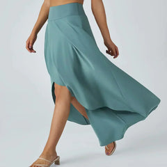 Teal-blue midi skirt with side-swept slit and flowing asymmetric hem