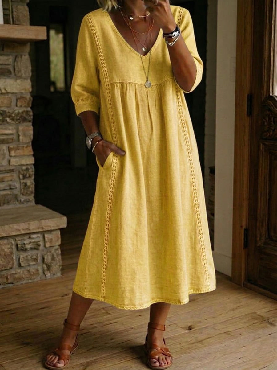 Yellow denim maxi dress with V-neck, gathered bodice, and 3/4 sleeves