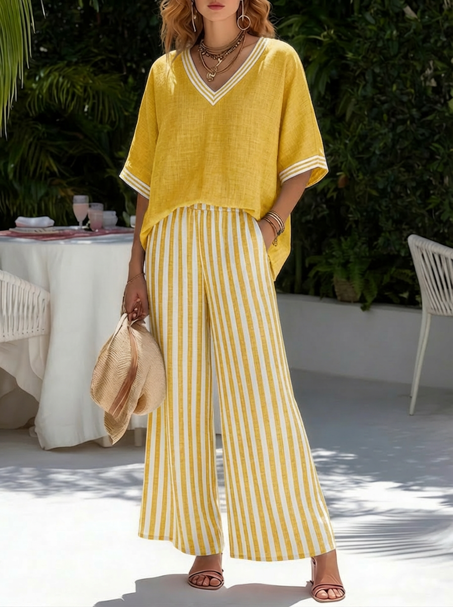 Completo giallo: top in lino con scollo a V e pantaloni a righe gialle e bianche
