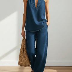 Washed blue denim sleeveless V-neck top with matching wide-leg pants two-piece set