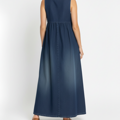 Blue denim maxi dress back view with gathered waist seam and button placket