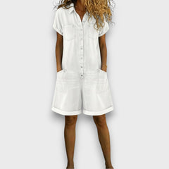 Denim-look short overalls in white with button front and two chest patch pockets, cuffed legs