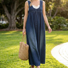 Blue denim maxi dress with scoop neckline, button placket, and side pockets