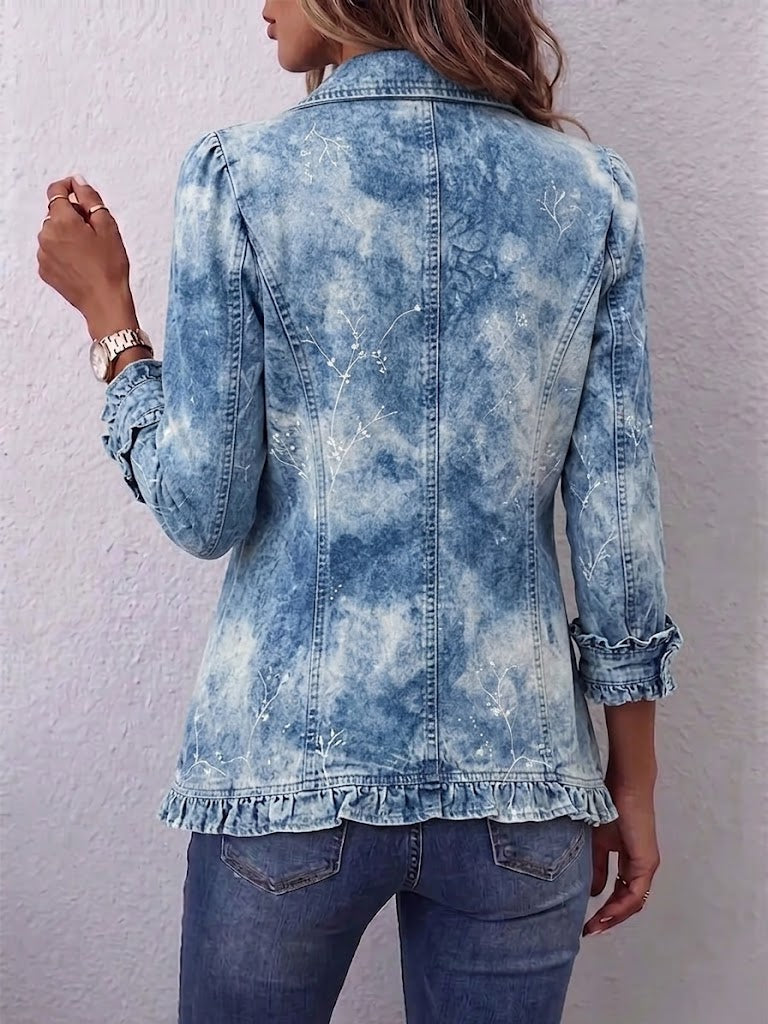 Blue vintage denim jacket back view with buttoned seams and ruffle-trim hem