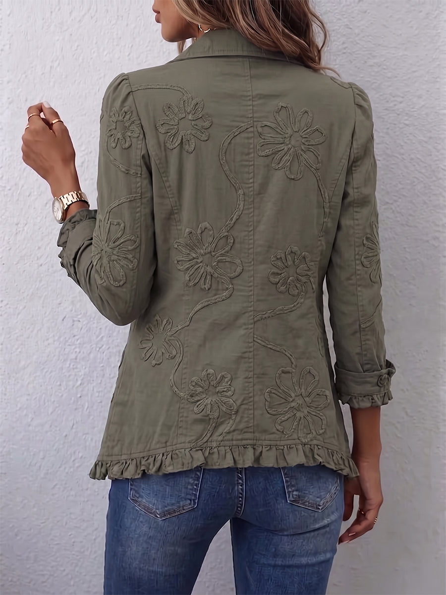 Olive utility jacket with floral embroidery on back, buttoned styling