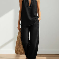 Black denim sleeveless V-neck top and relaxed wide-leg pants two-piece set