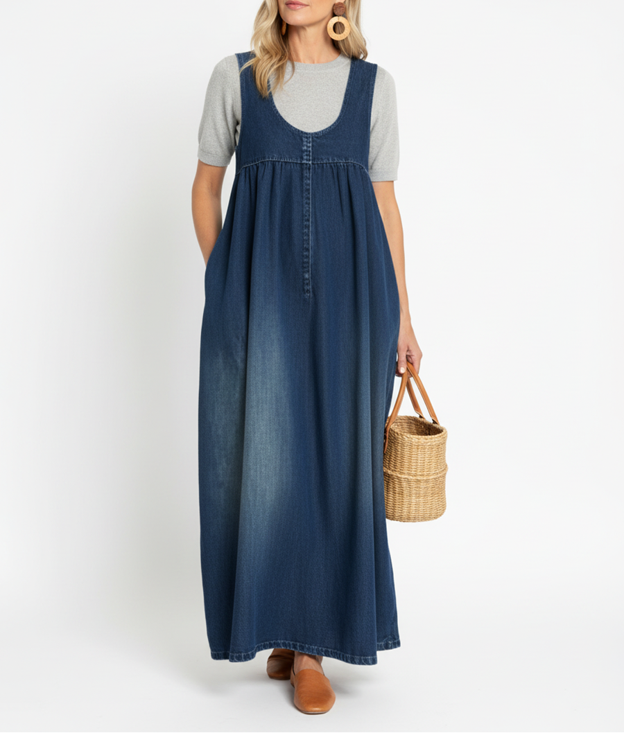 Blue denim maxi dress with scoop neck, sleeveless bodice and gathered skirt seams