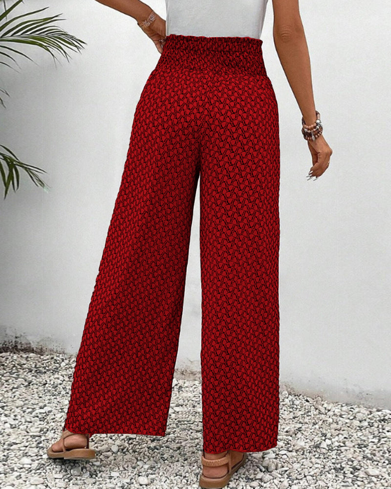Red wide-leg trousers with shirred waist and micro pattern, straight wide leg.