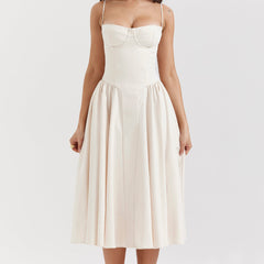 Abito corsetto crema a spalline, scollo a cuore e gonna svasata midi