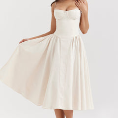 Abito corsetto crema a spalline sottili, scollo a cuore e gonna svasata midi