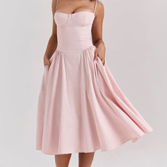 Abito corsetto rosa cipria a spalline sottili, gonna svasata midi