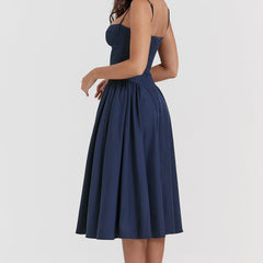 Abito corsetto blu navy con spalline sottili e gonna svasata a pieghe