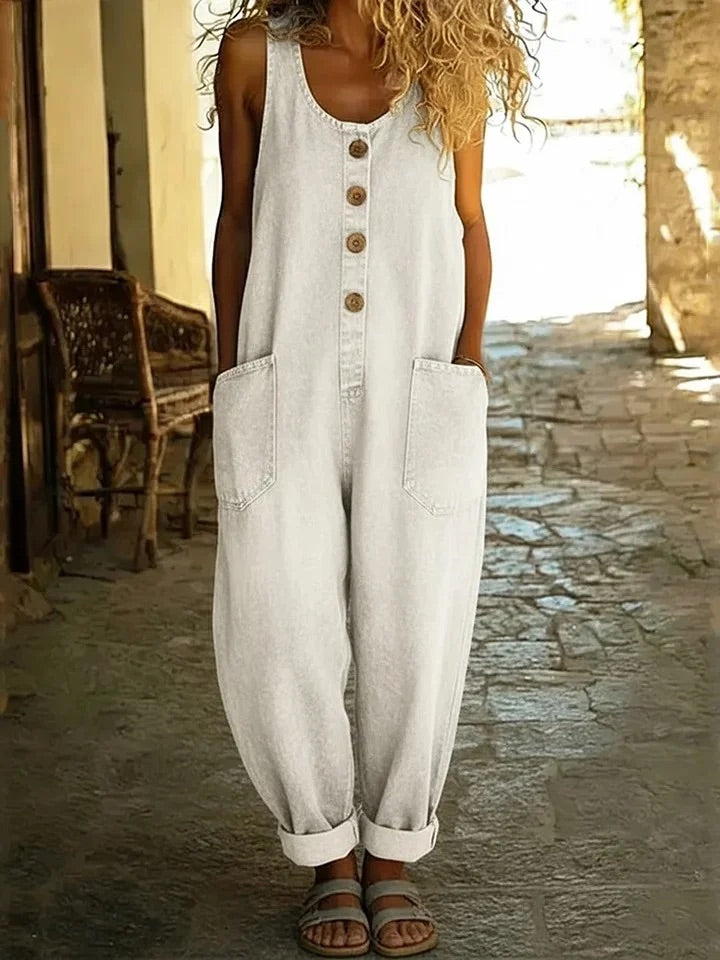 White denim overalls, sleeveless with button front and chest pockets, relaxed wide legs