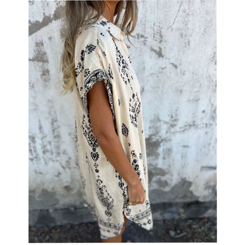 Abito beige stampato con maniche ad aletta e orlo dritto, lato in vista.