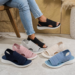 Sandali ortopedici slip-on neri, rosa, beige e azzurri su suola bianca
