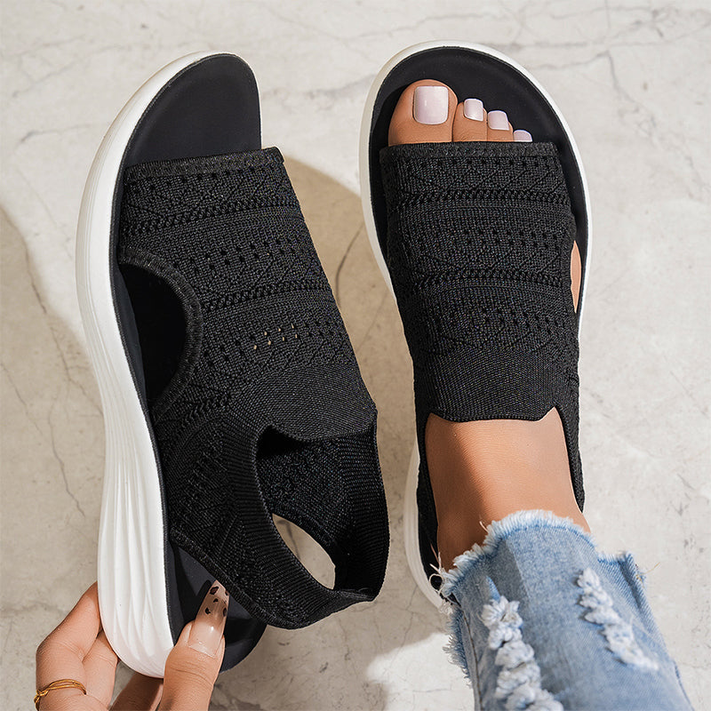 Sandali ortopedici slip-on neri con fascia a maglia elasticizzata e suola bianca