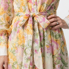 Floral sheer maxi dress close-up, bow tie and button placket detail
