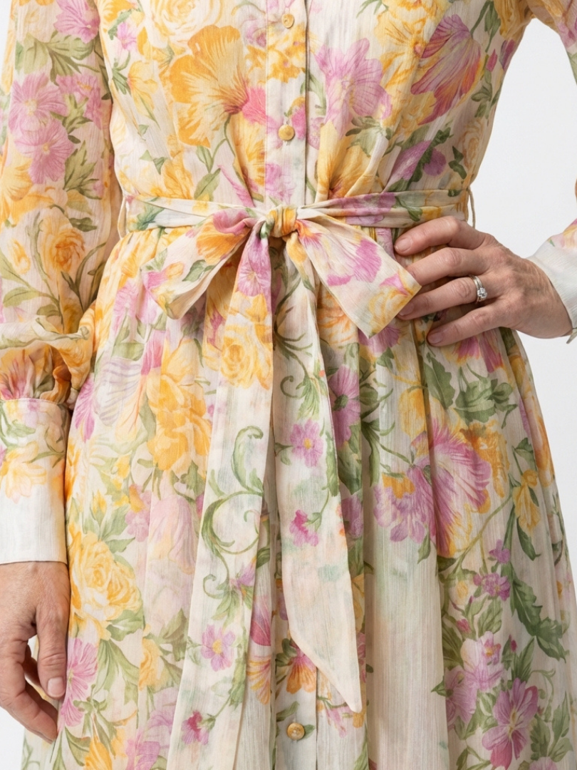 Floral sheer maxi dress close-up, bow tie and button placket detail