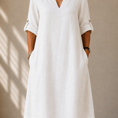 White classic V-neck midi dress with three-quarter sleeves and side pockets