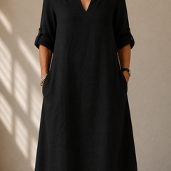 Black V-neck midi dress with elbow-length sleeves and side pockets