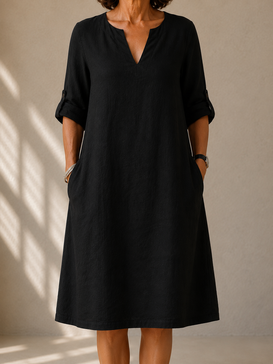 Black V-neck midi dress with elbow-length sleeves and side pockets